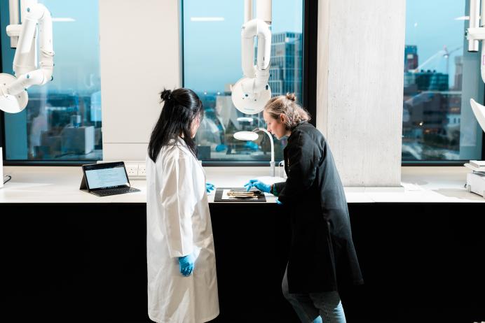 Libby Ireland and a MSc student discuss the degredation of a plastic object. Photograph James Tye