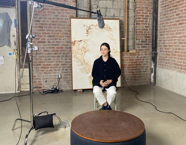 Gala Porras-Kim interviewed for the Getty Conservation Institute in front of A terminal escape from the place that binds us, 2021, courtesy of Gala Porras-Kim, photo Rachel Rivenc.