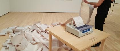 Hans Haacke, News, 1969/2008. Newsfeed, paper, and printer. Installation view, SFMOMA, 2018. Photo: Dušan Barok.